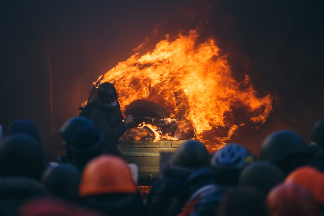 Burning car during anti-government riot